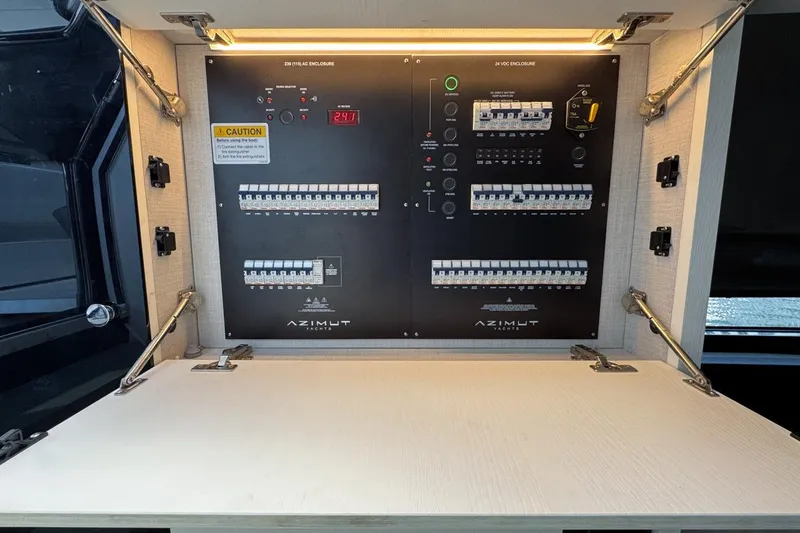 Slide: The Image of Electrical panel of 2023 Azimut Verve 47 yacht, showcasing circuit breakers and controls. - 70