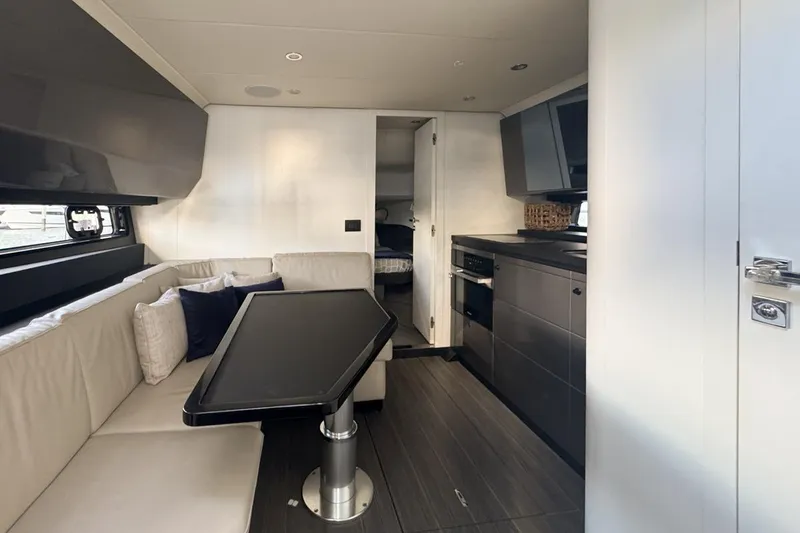 Slide: The Image of Luxurious interior of 2023 Azimut Verve 47 yacht with modern kitchen and seating area. - 75