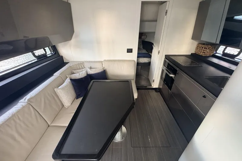 Slide: The Image of Luxurious interior of 2023 Azimut Verve 47 yacht with modern kitchen and seating area. - 76