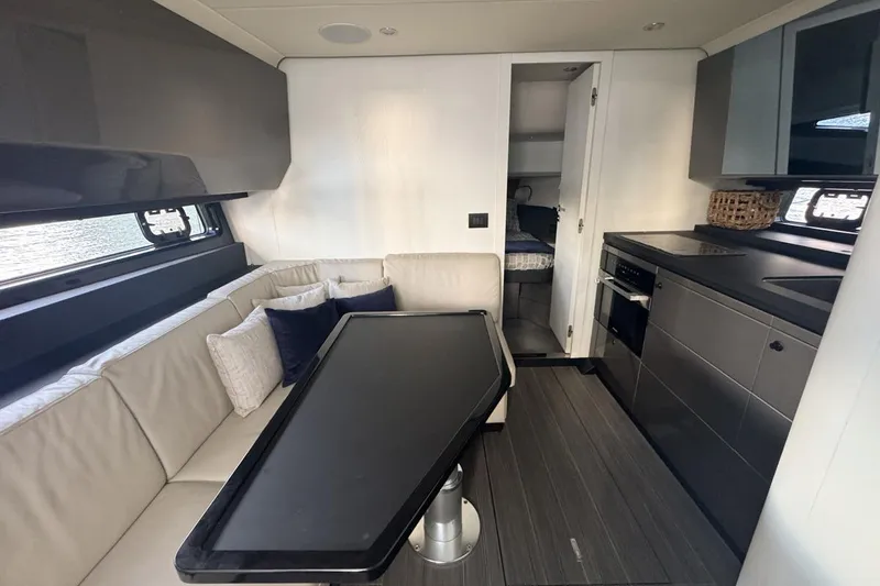 Slide: The Image of Luxurious interior of 2023 Azimut Verve 47 yacht with modern kitchen and seating area. - 77