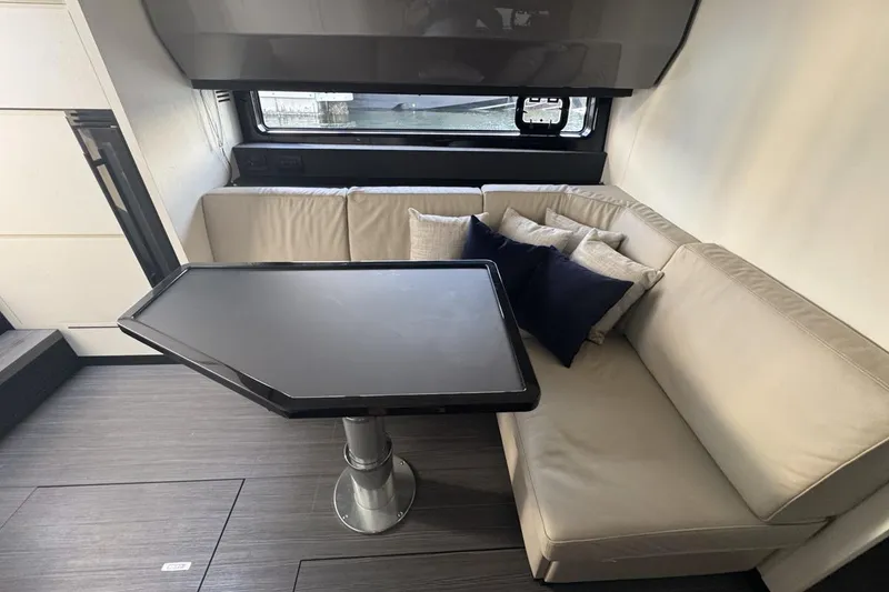 Slide: The Image of Luxurious interior of 2023 Azimut Verve 47 yacht with modern seating and table. - 80