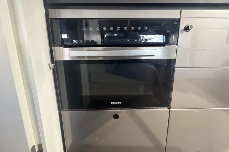 Slide: The Image of Modern Miele oven in Azimut Verve 47 yacht kitchen, 2023 model. - 83
