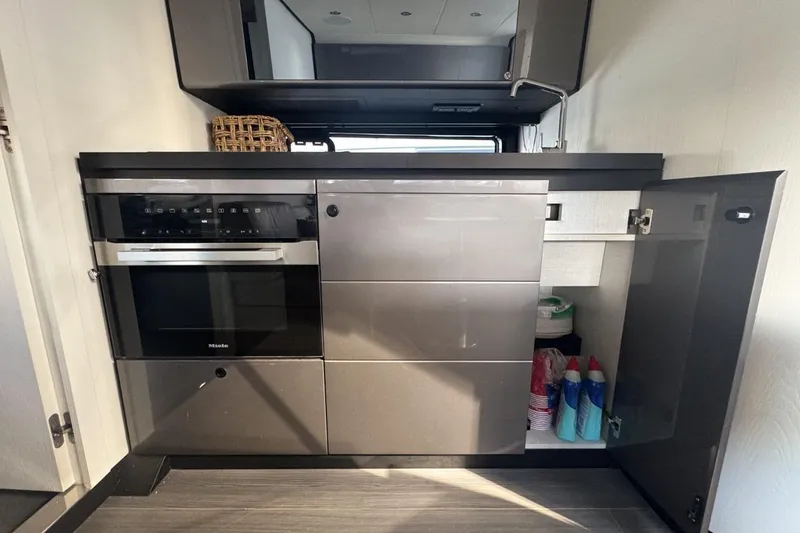 Slide: The Image of Modern kitchen interior of 2023 Azimut Verve 47 yacht with sleek cabinetry and appliances. - 86