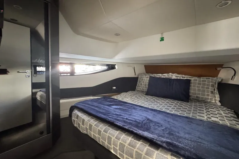 Slide: The Image of Luxurious cabin interior of 2023 Azimut Verve 47 yacht with modern bedding. - 91