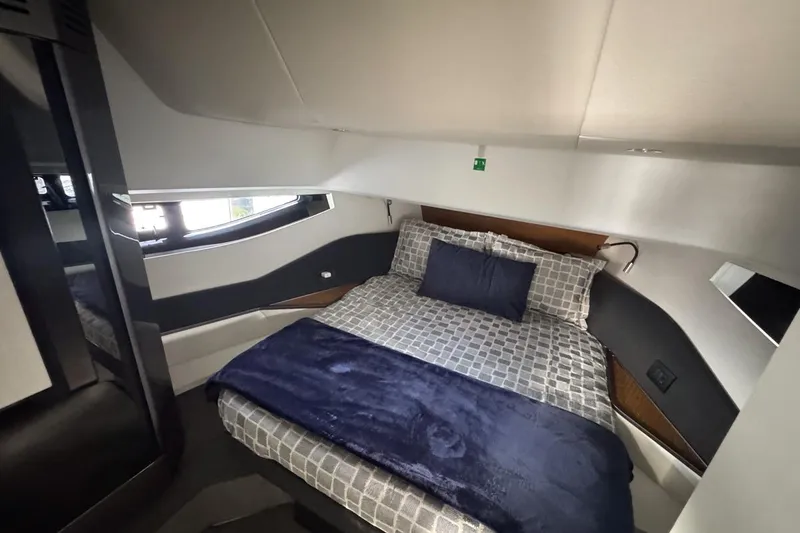 Slide: The Image of Luxurious bedroom interior of 2023 Azimut Verve 47 yacht with modern design and cozy bedding. - 93