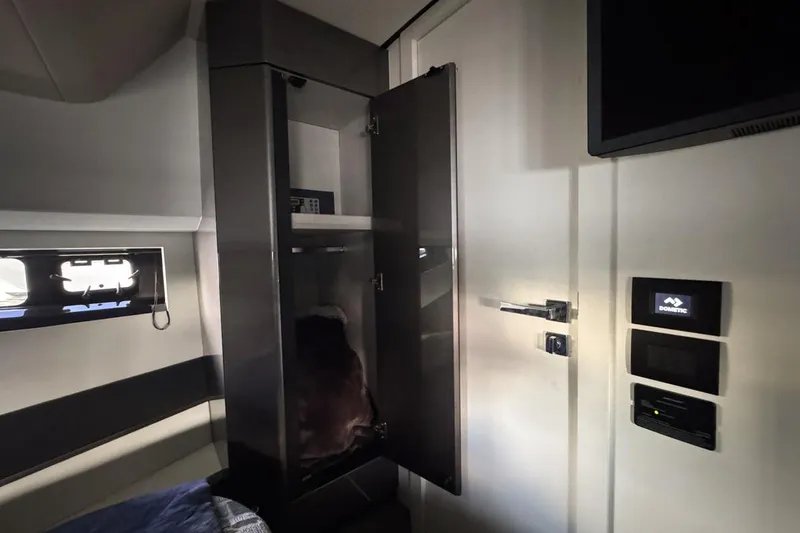 Slide: The Image of Interior of 2023 Azimut Verve 47 yacht, featuring sleek cabinetry and modern controls. - 97
