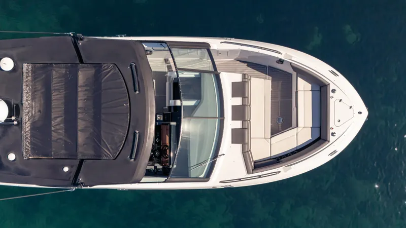 Slide: The Image of Top view of 2021 Cruisers Yachts 38 GLS OB 450R on clear water. - 13