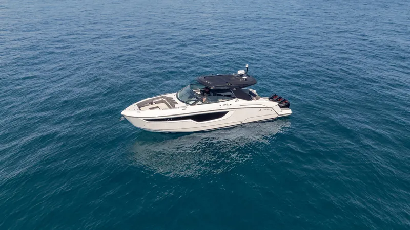 Slide: The Image of 2021 Cruisers Yachts 38 GLS OB 450R on open water, side view. - 16