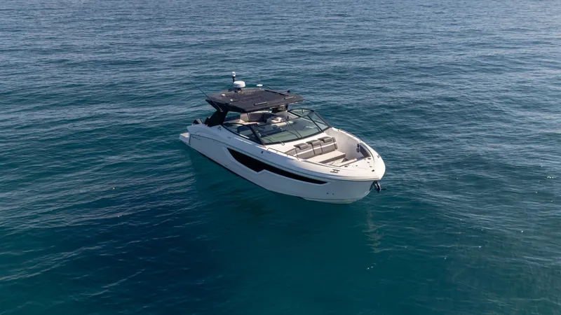 Slide: The Image of 2021 Cruisers Yachts 38 GLS OB 450R on open water, showcasing sleek design. - 20
