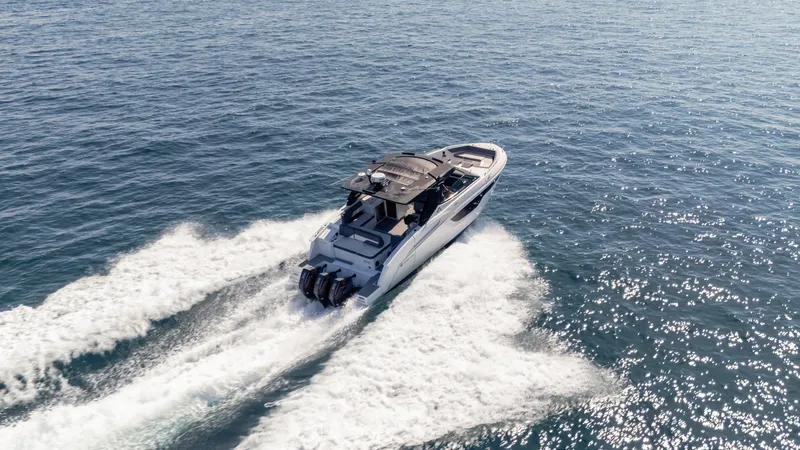 Slide: The Image of 2021 Cruisers Yachts 38 GLS OB 450R speeding on open water. - 24