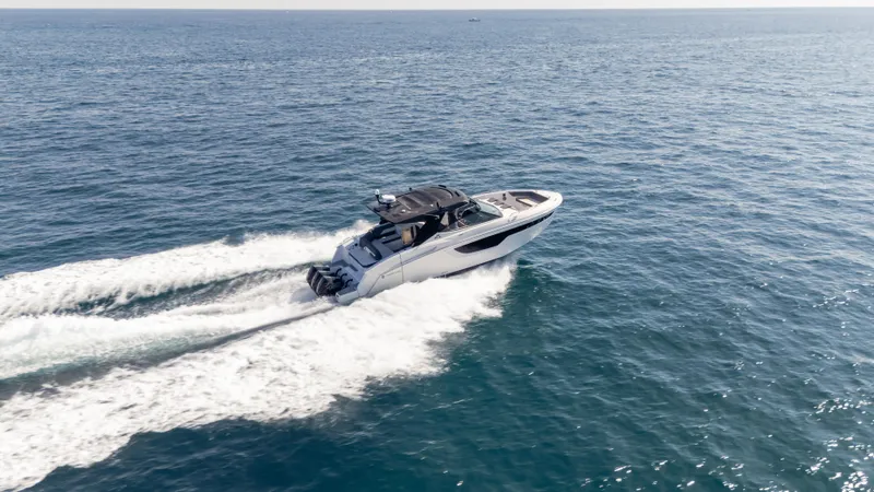 Slide: The Image of 2021 Cruisers Yachts 38 GLS OB 450R speeding on open ocean waters. - 25