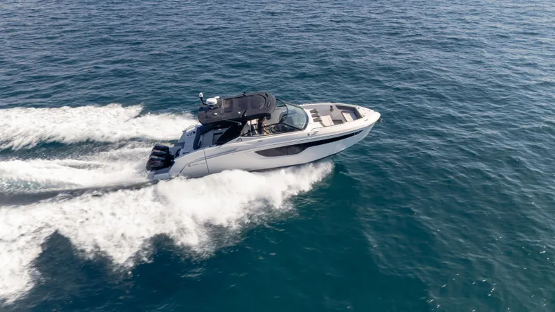 Slide: The Image of 2021 Cruisers Yachts 38 GLS OB 450R speeding on open water. - 26
