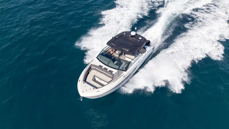 Slide: The Image of 2021 Cruisers Yachts 38 GLS OB 450R speeding on open water. - 3