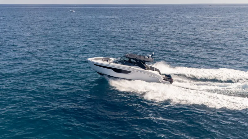 Slide: The Image of 2021 Cruisers Yachts 38 GLS OB 450R speeding on open ocean waters. - 30