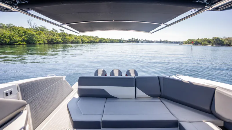 Slide: The Image of 2021 Cruisers Yachts 38 GLS OB 450R, spacious deck view, serene water backdrop. - 41