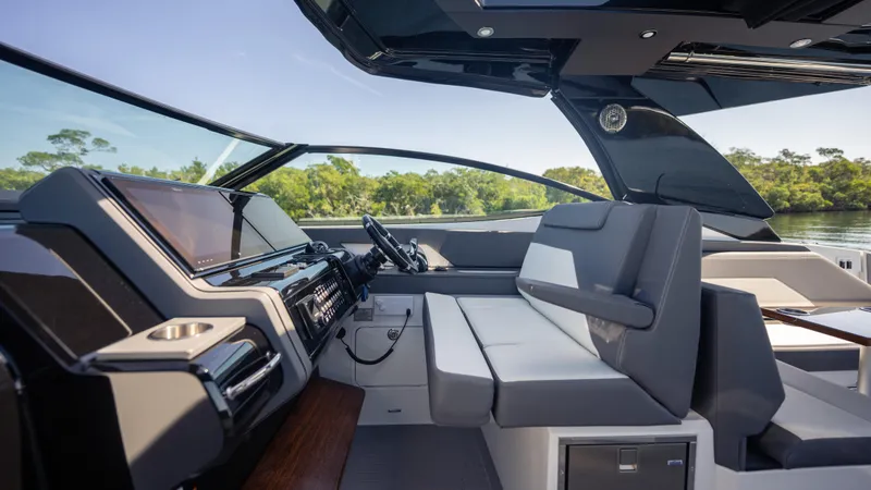 Slide: The Image of Interior of 2021 Cruisers Yachts 38 GLS OB 450R, featuring sleek design and modern controls. - 42