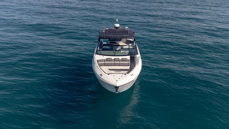 Slide: The Image of 2021 Cruisers Yachts 38 GLS OB 450R on open water, front view. - 21