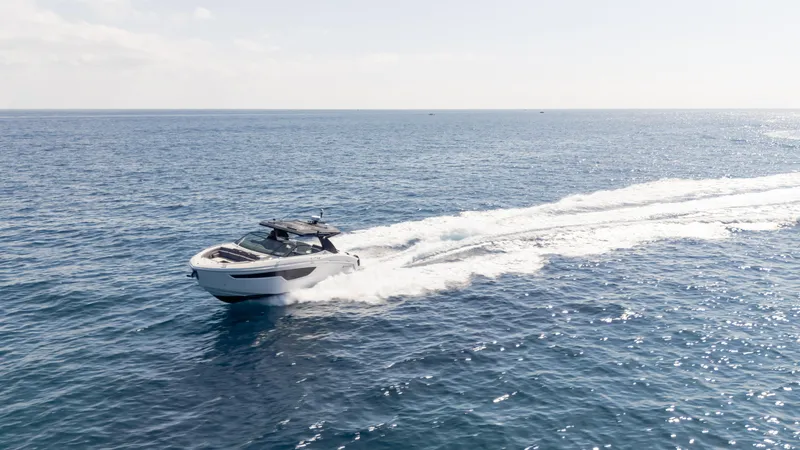 Slide: The Image of 2021 Cruisers Yachts 38 GLS OB 450R speeding on open ocean waters. - 29