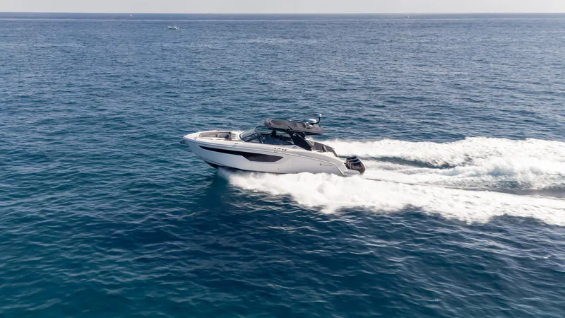 Slide: The Image of 2021 Cruisers Yachts 38 GLS OB 450R speeding on open ocean waters. - 31