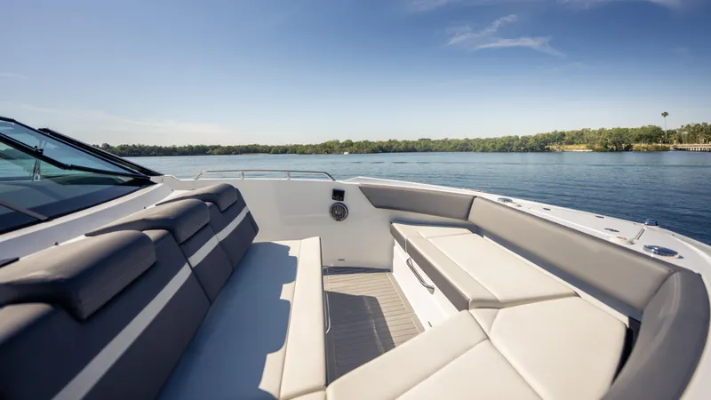 Slide: The Image of Luxurious seating on 2021 Cruisers Yachts 38 GLS OB 450R, overlooking serene water. - 36