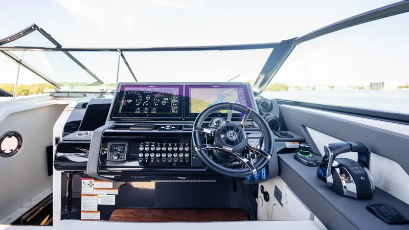 Slide: The Image of Cockpit of 2021 Cruisers Yachts 38 GLS OB 450R with modern controls and navigation screens. - 37
