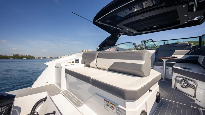 Slide: The Image of 2021 Cruisers Yachts 38 GLS OB 450R, luxurious seating, open deck, sunny day on the water. - 40
