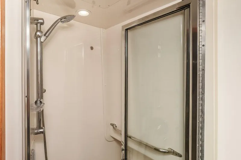 Slide: The Image of Shower area in 2008 Cabo Yachts 38 EXPRESS with sliding glass door. - 13