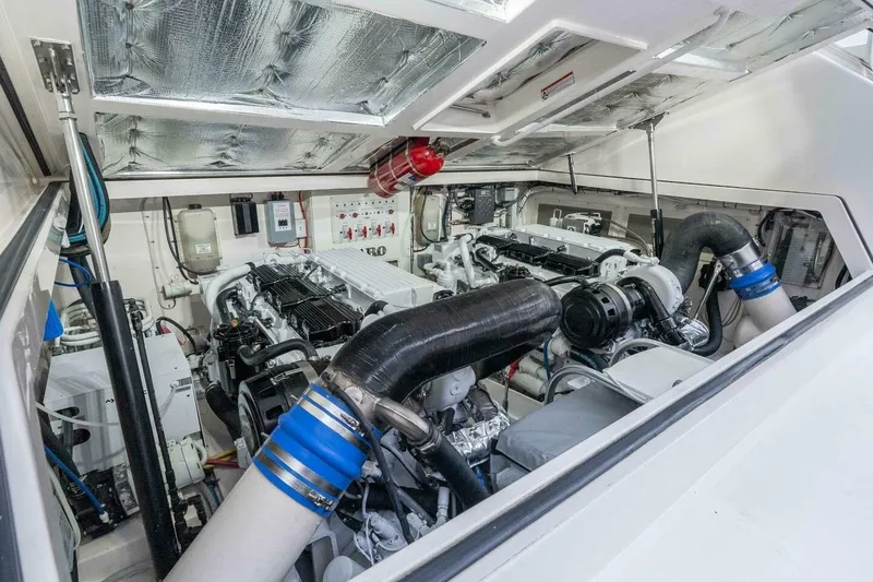 Slide: The Image of Engine room of 2008 Cabo Yachts 38 EXPRESS, showcasing dual engines and mechanical systems. - 14