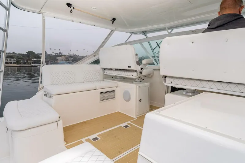 Slide: The Image of 2008 Cabo Yachts 38 EXPRESS interior with white seating and wooden flooring. - 19