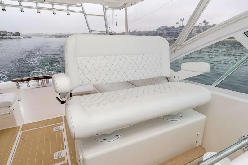 Slide: The Image of Luxurious seating on 2008 Cabo Yachts 38 EXPRESS, overlooking serene waters. - 21