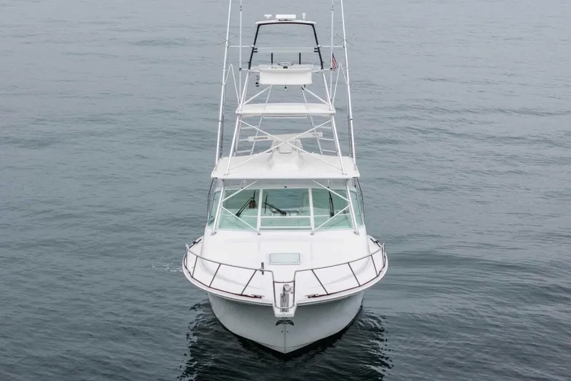 Slide: The Image of 2008 Cabo Yachts 38 EXPRESS on calm water, front view. - 25