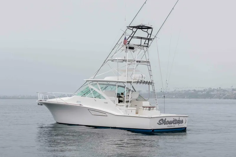 Slide: The Image of 2008 Cabo Yachts 38 EXPRESS fishing boat on calm waters. - 32
