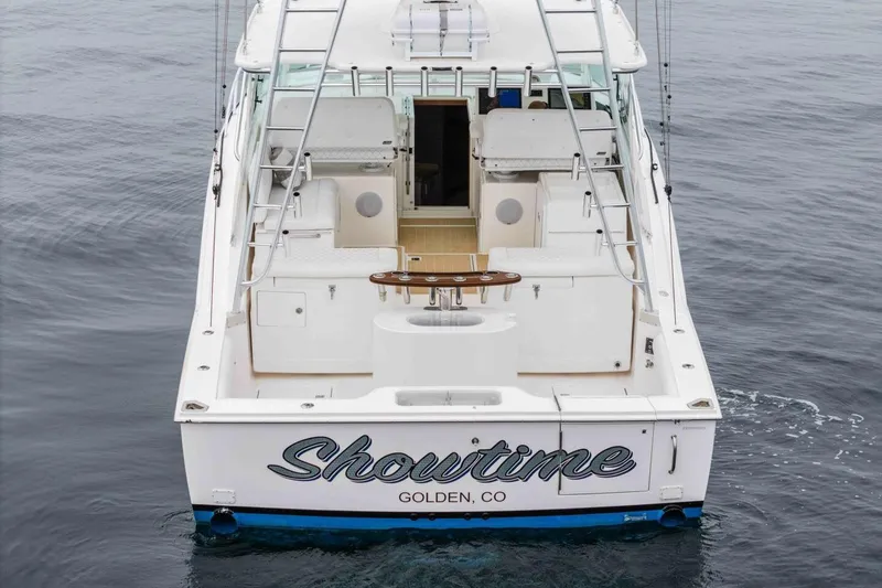 Slide: The Image of 2008 Cabo Yachts 38 EXPRESS boat named "Showtime" on calm water. - 35