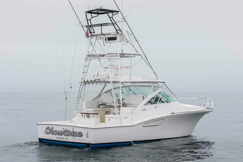 Slide: The Image of 2008 Cabo Yachts 38 EXPRESS boat on calm ocean waters. - 36