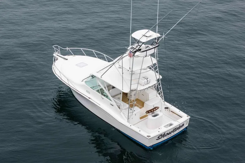 Slide: The Image of 2008 Cabo Yachts 38 EXPRESS fishing boat on open water, aerial view. - 38