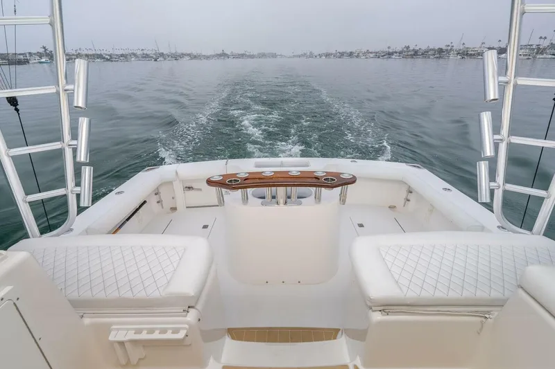 Slide: The Image of 2008 Cabo Yachts 38 EXPRESS boat deck with ocean view and fishing rod holders. - 4