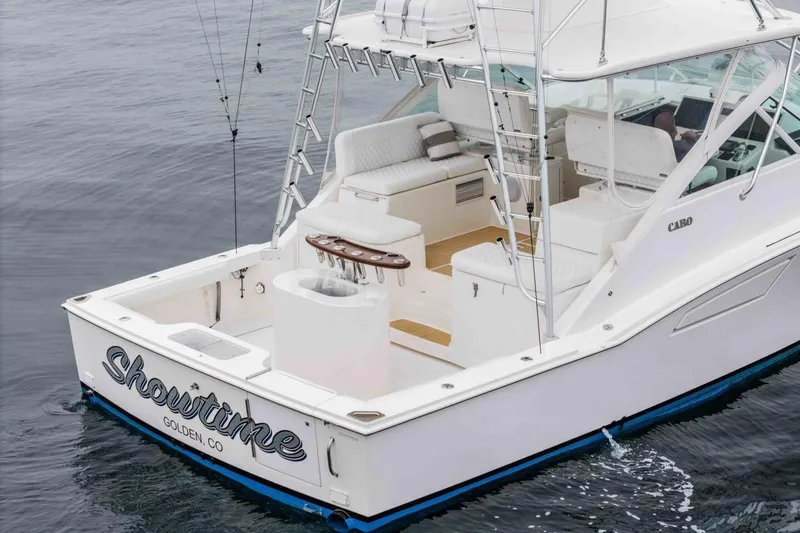 Slide: The Image of 2008 Cabo Yachts 38 EXPRESS on water, featuring spacious deck and fishing equipment. - 6