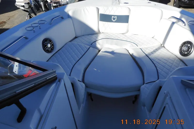 Slide: The Image of 2026 Sea Fox 228 Traveler boat interior with cushioned seating and speakers. - 14