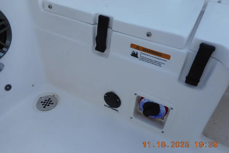 Slide: The Image of 2026 Sea Fox 228 Traveler boat interior with warning label and battery charger. - 21