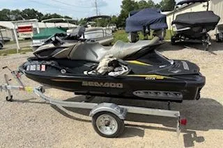 The Image of 2017 Sea-Doo GTX 155 jet ski on trailer, parked outdoors. - 0