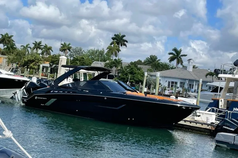 The Image of 2021 Cruisers Yachts 338 South Beach Edition Bow Rider docked in a marina. - 0