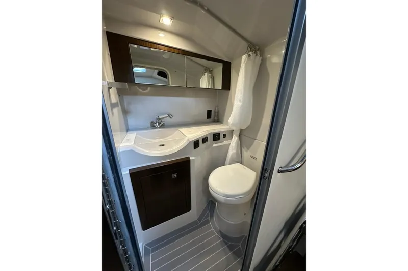 Slide: The Image of 2021 Cruisers Yachts 338 South Beach Edition Bow Rider bathroom interior with modern fixtures. - 19