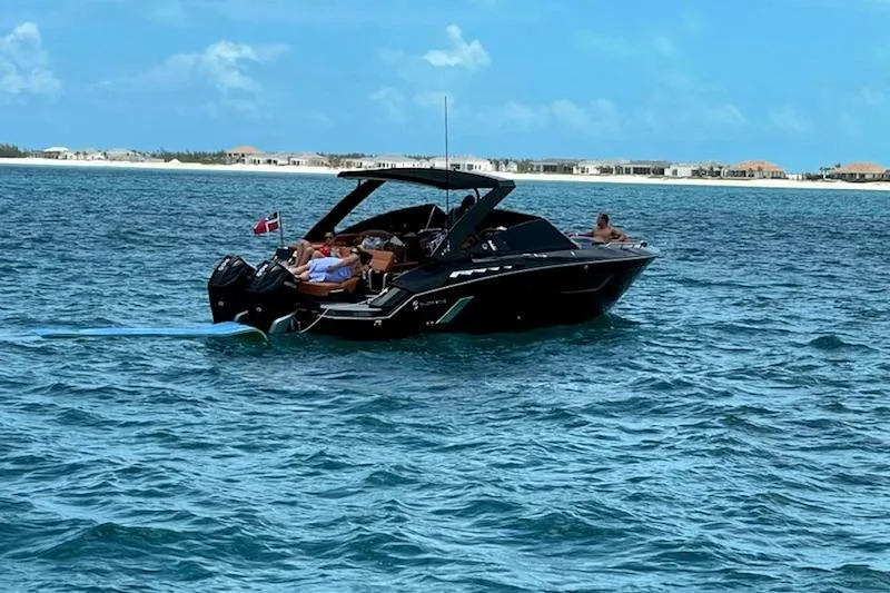 Slide: The Image of 2021 Cruisers Yachts 338 South Beach Edition Bow Rider on open water. - 2
