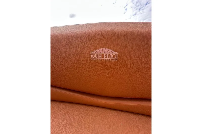 Slide: The Image of Luxurious leather seating in 2021 Cruisers Yachts 338 South Beach Edition Bow Rider. - 23