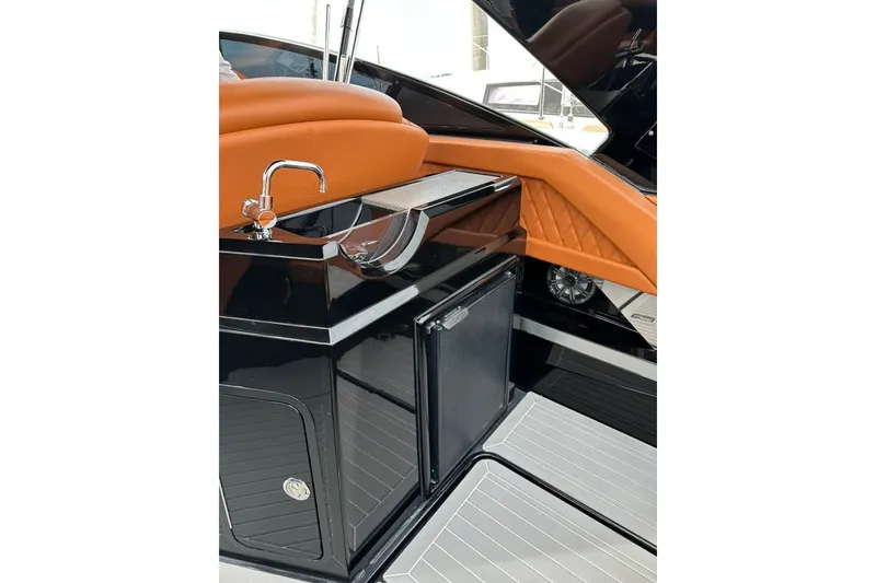 Slide: The Image of 2021 Cruisers Yachts 338 South Beach Edition Bow Rider interior with sleek sink and cabinetry. - 33