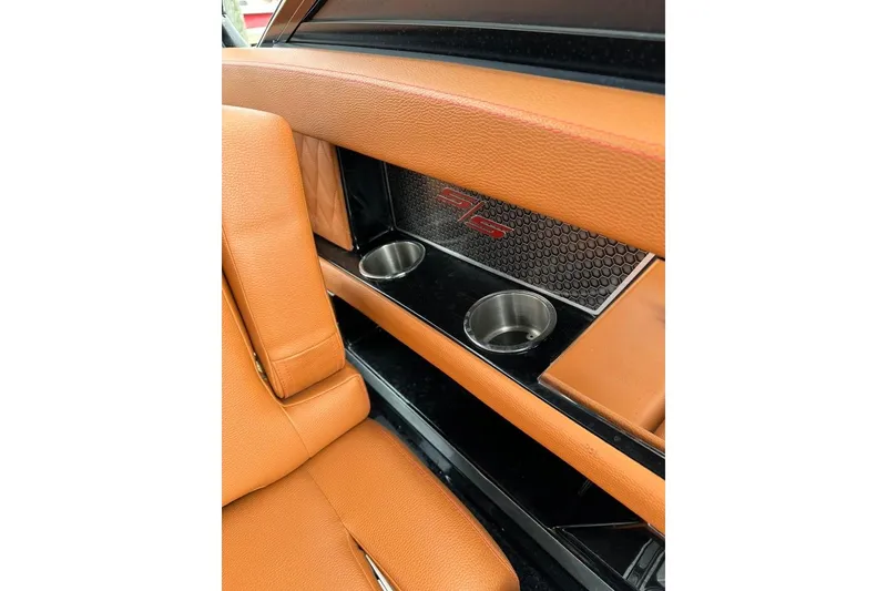 Slide: The Image of 2021 Cruisers Yachts 338 South Beach Edition interior with orange leather and cup holders. - 35