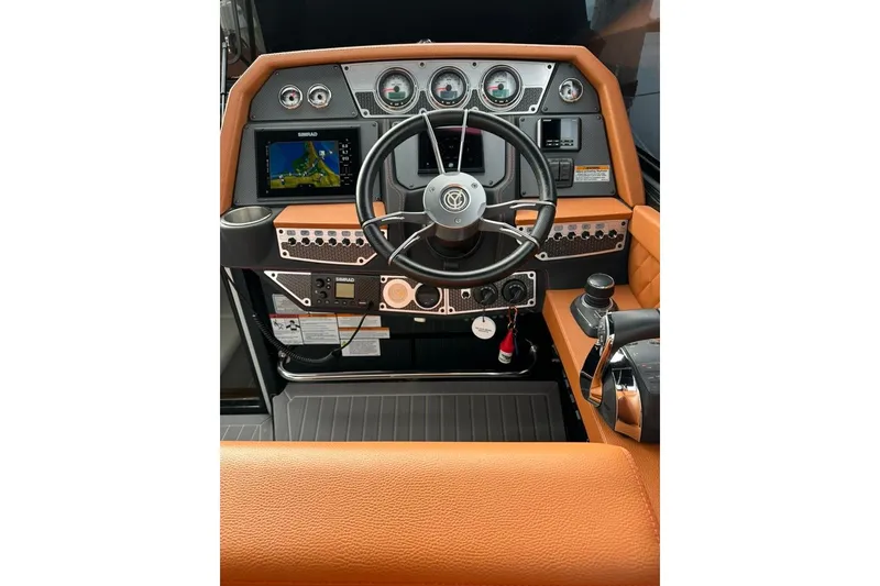 Slide: The Image of 2021 Cruisers Yachts 338 South Beach Edition Bow Rider helm with modern controls and navigation. - 5