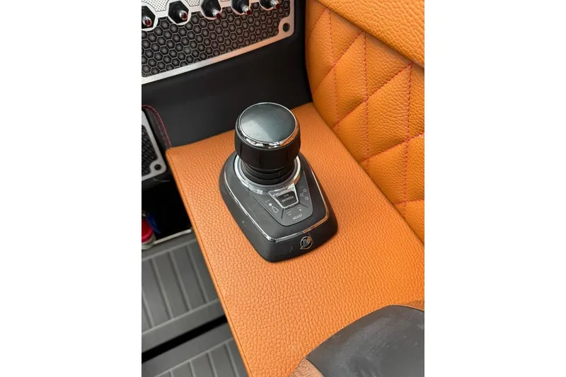 Slide: The Image of Joystick control on 2021 Cruisers Yachts 338 South Beach Edition Bow Rider, orange leather detail. - 8