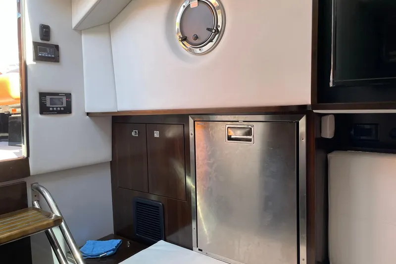 Slide: The Image of Interior of 2021 Cruisers Yachts 338 South Beach Edition Bow Rider, featuring modern amenities. - 12