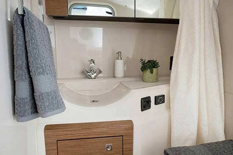 Slide: The Image of Manufacturer Provided Image: Luxurious bathroom interior of 2021 Cruisers Yachts 338 South Beach Edition Bow Rider. - 18